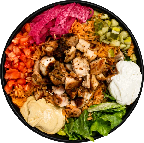 Overhead grilled chicken bowl with rice, hummus, garlic sauce, pickled onion and traditional veggies