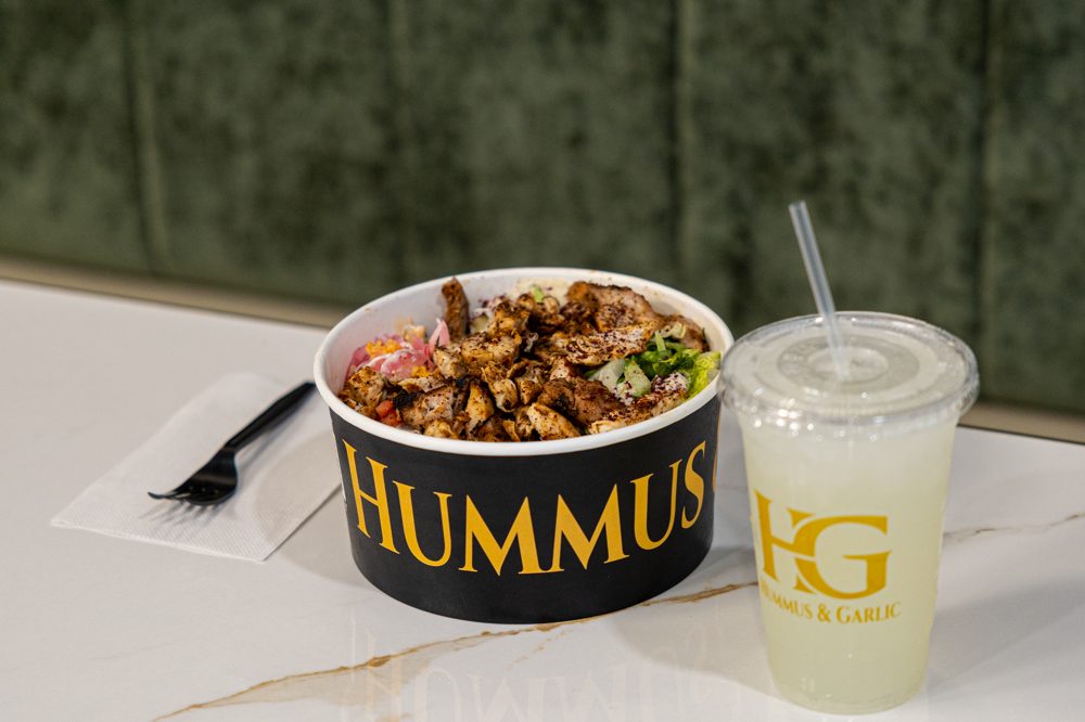 Bowl and drink on the counter at Hummus & Garlic