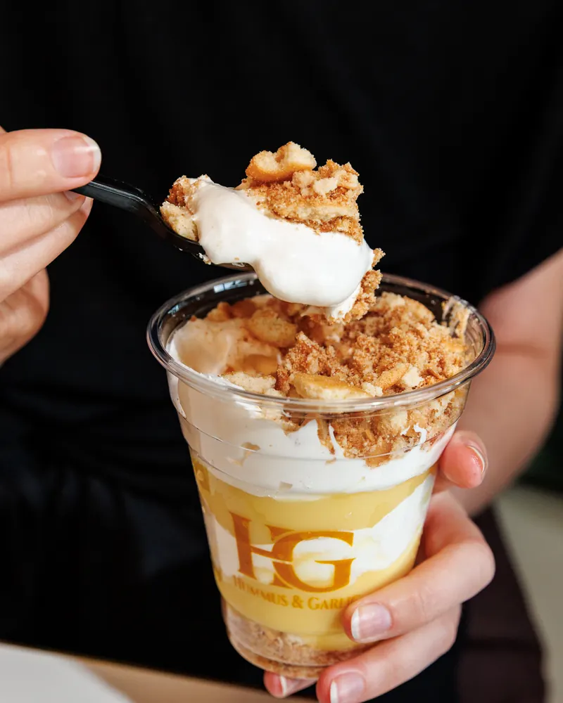 A spoonful of banana vanilla wafer parfait lifted from the cup