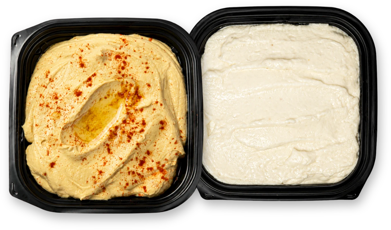 A side of hummus and a side of garlic sauce
